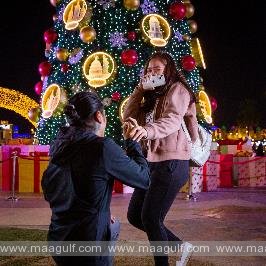 Couple get engaged under the giant festive tree at Global Village