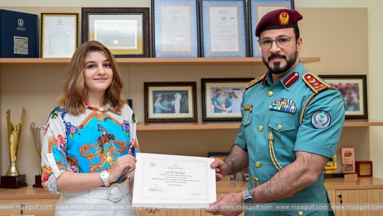 BG Aref Hudaib honours a student for her media cooperation