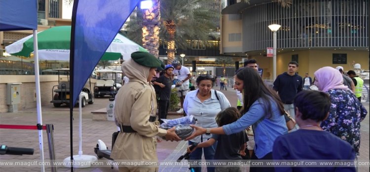 20 Dubai Police and RTA Distribute Safety Gear to Cyclists and Scooter Riders