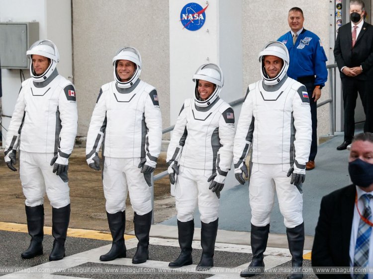 Four astronauts reach International Space Station in record time